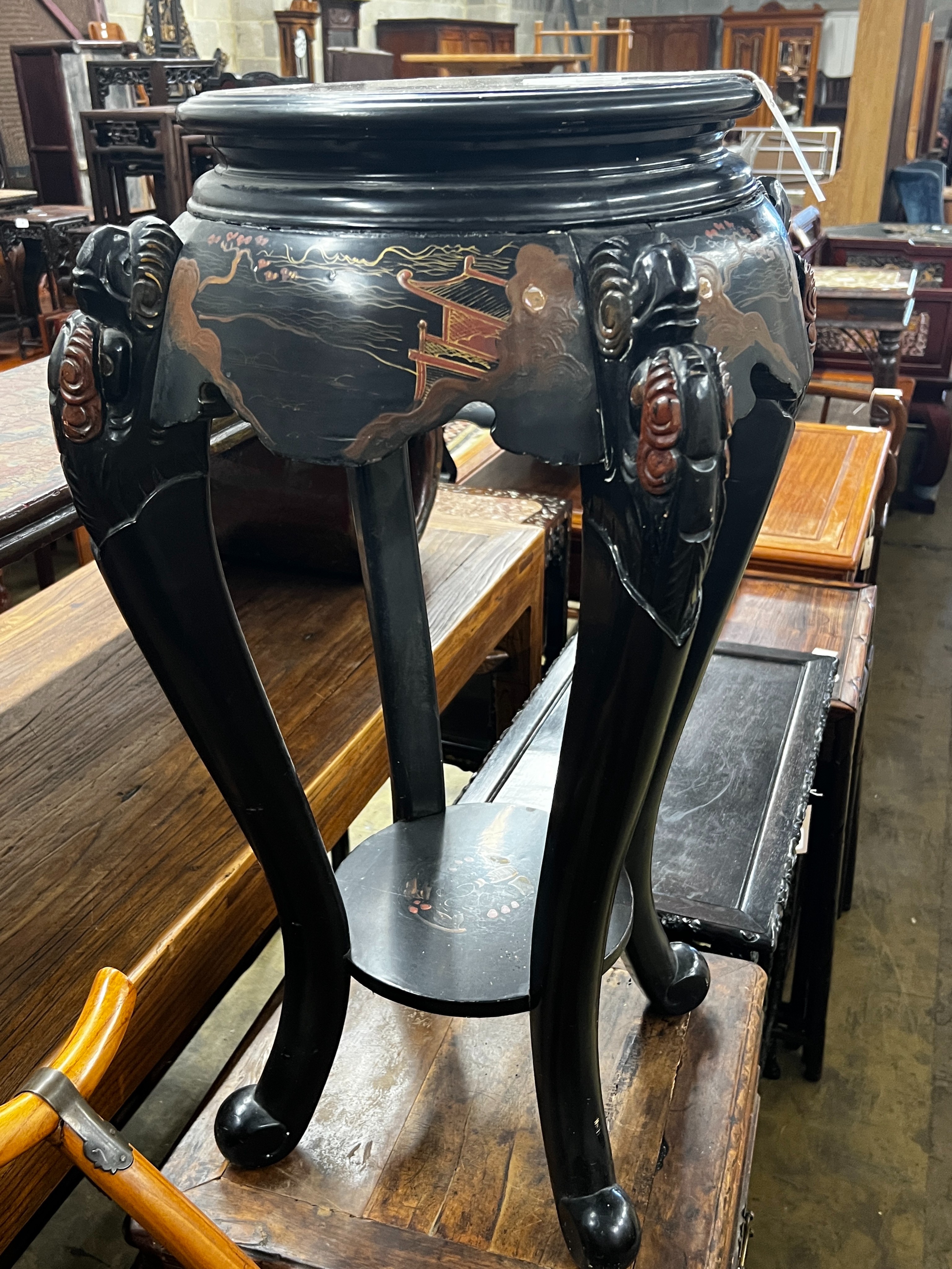 A Japanese lacquer two tier vase stand, height 76cm